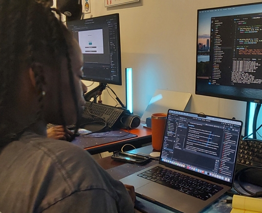 Apprentices solving a problem at the whiteboard.